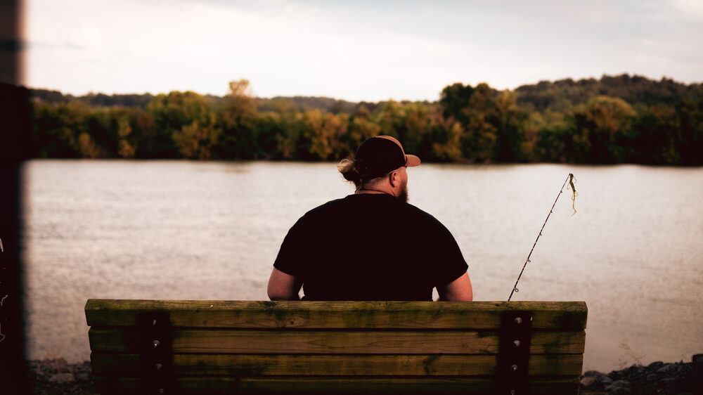 Hank Singleton bank fishing by the river