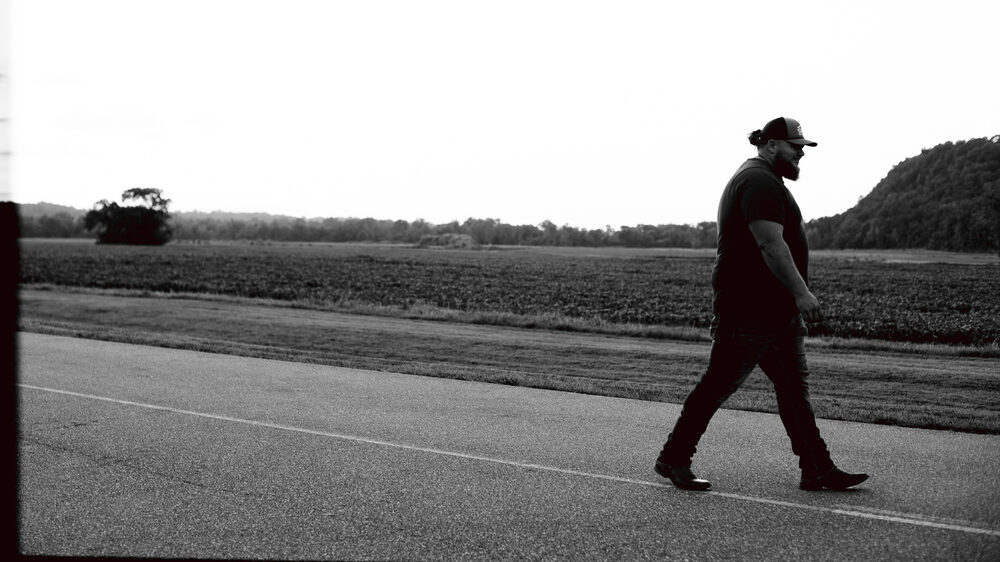 Hank Singleton walking a road outside Nashville, Tennessee